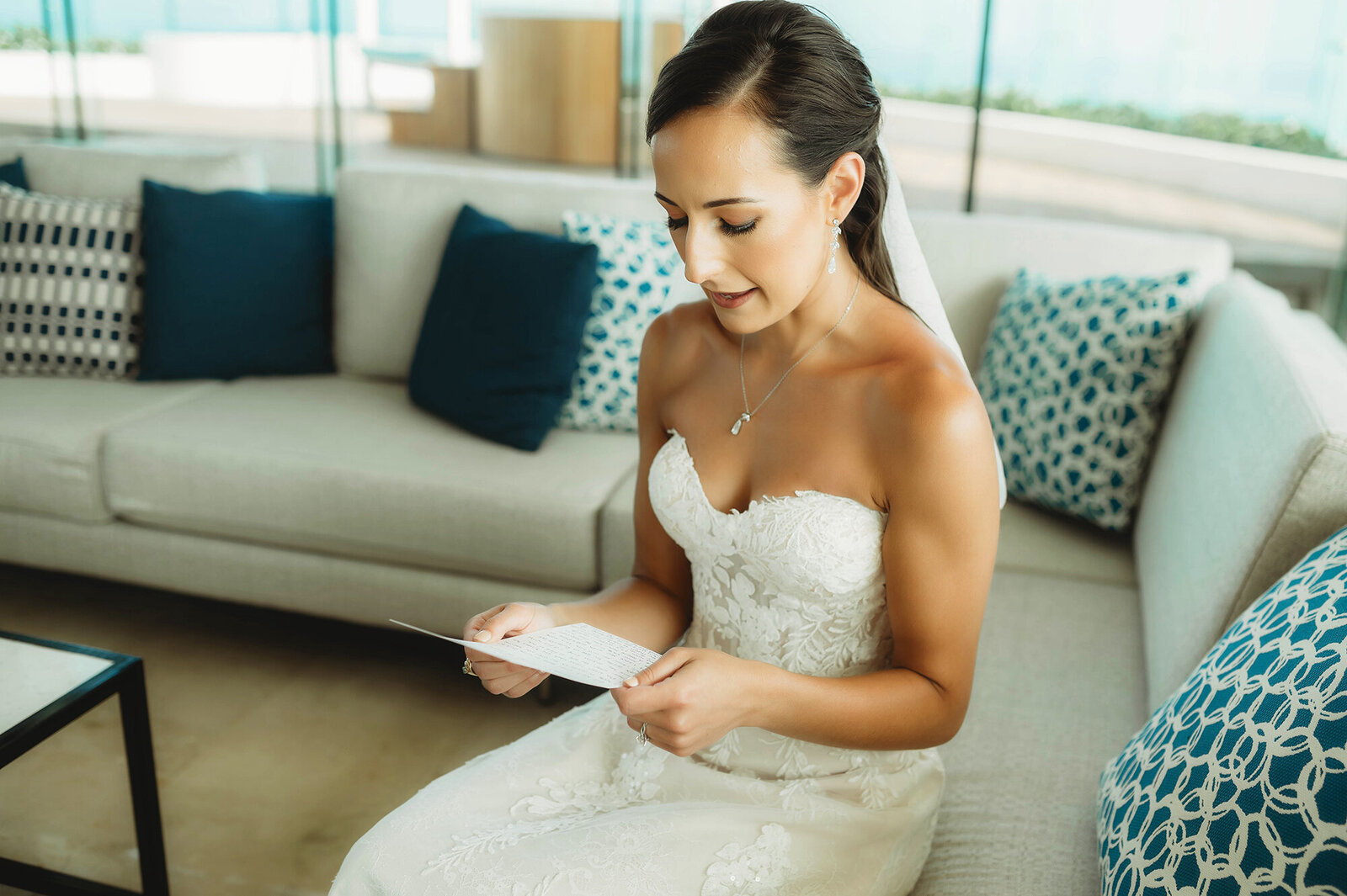 Bride reads a note from her groom on her Micro-Wedding Day at Live Aqua in Cancun, Mexico.