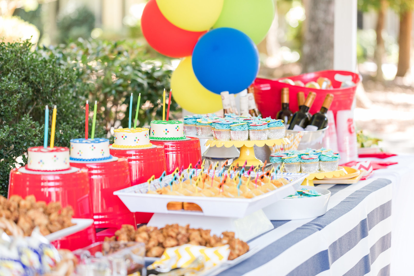 mother walks hand in hand with daughter and holds small child at Myrtle Beach beautiful moment with family photographer jamie lucido