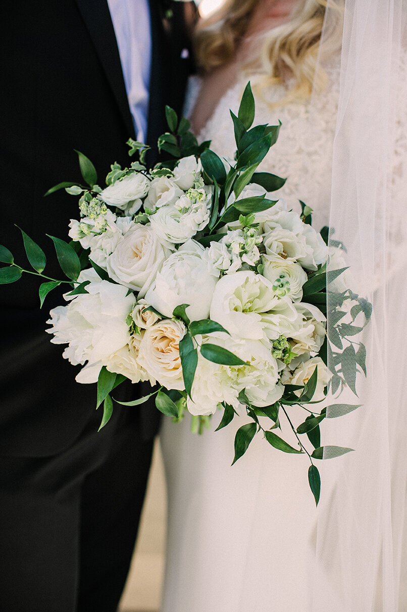 A lush green and white bridal bouquet by Flowers by Stems in Chicago.