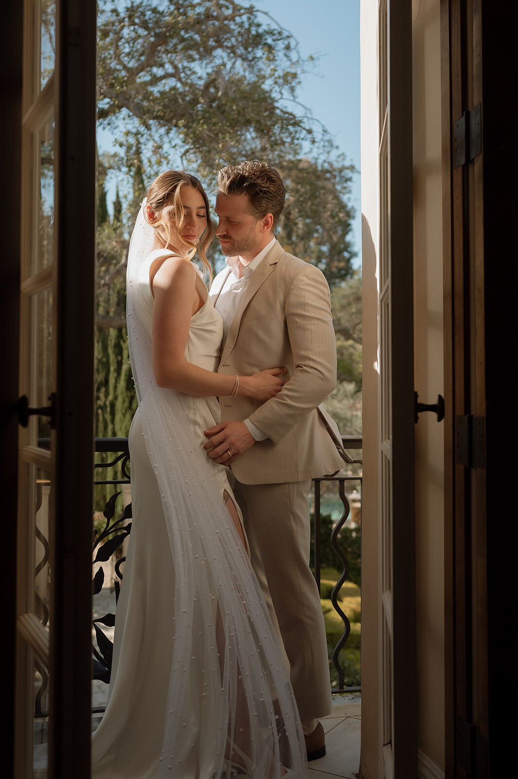 bride and groom photo of them standing next to each other