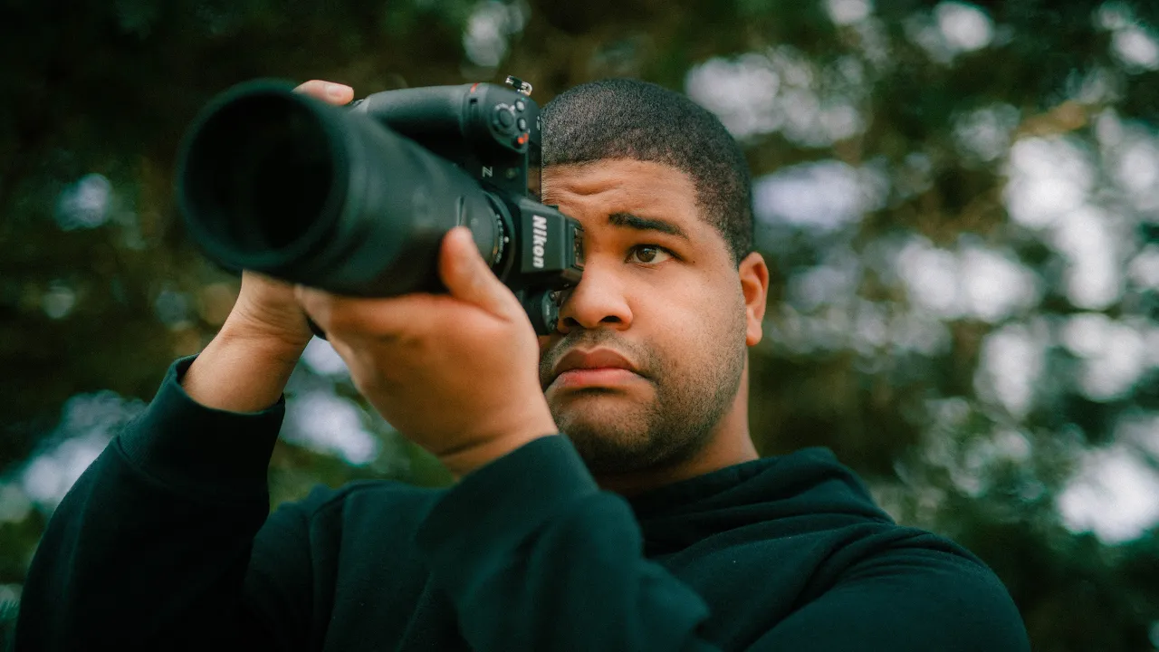 Sidney Baker-Green with his Nikon camera