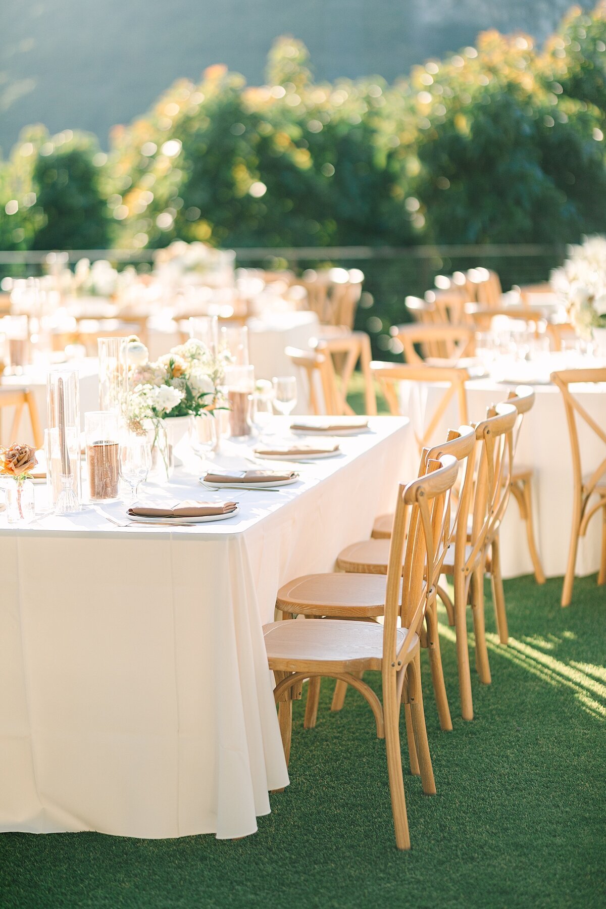 Reception tables with florals by Soiree Florals designed by Everly and Co in Temecula, California.