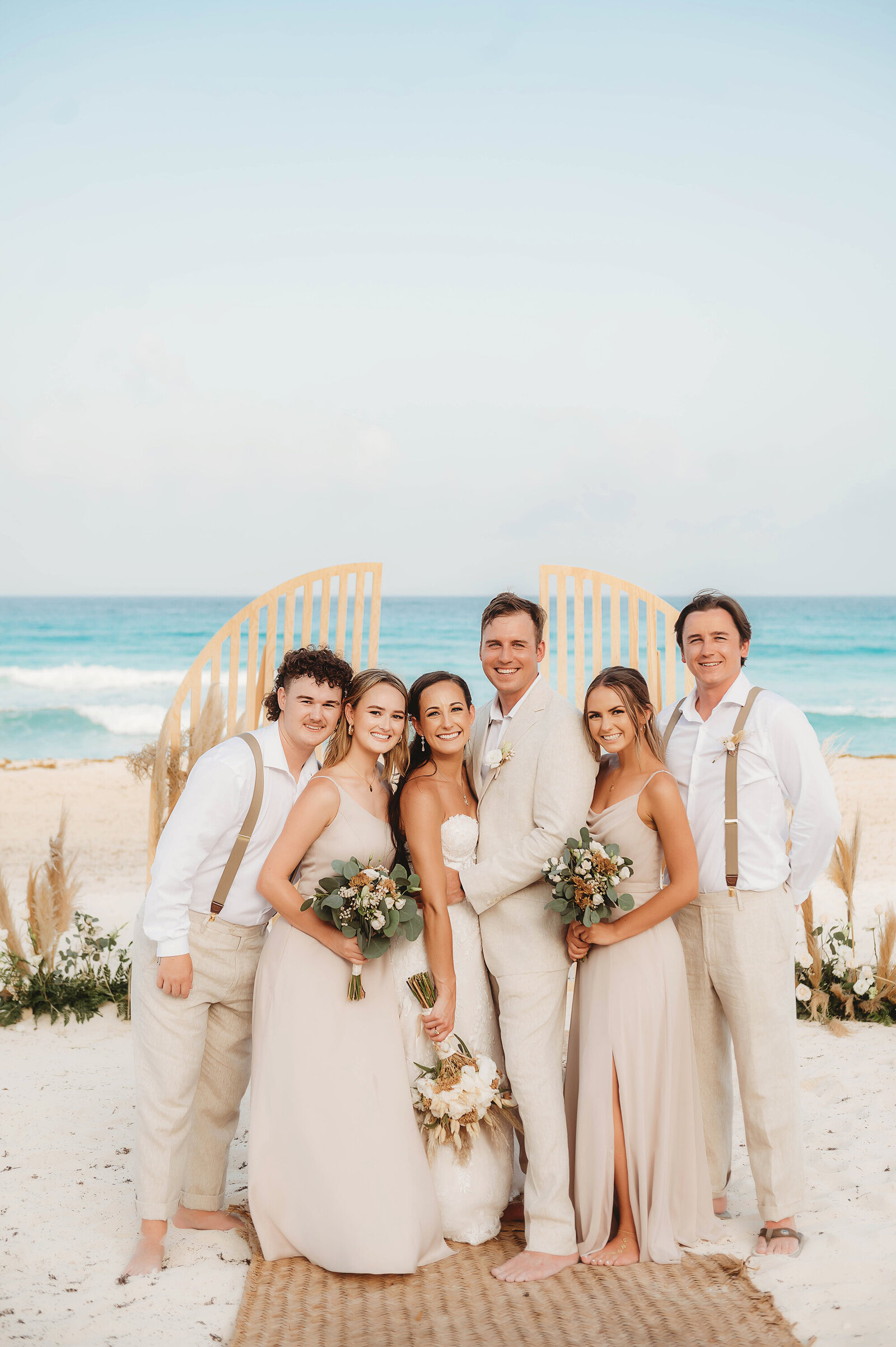 Bridal Party poses for portraits during Micro Wedding at Live Aqua Resort in Cancun Mexico.