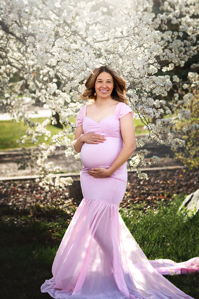 stunning-pregnant-mommy-spring-white-blossom-trees-fairytale-farm-colorado-pink-dress