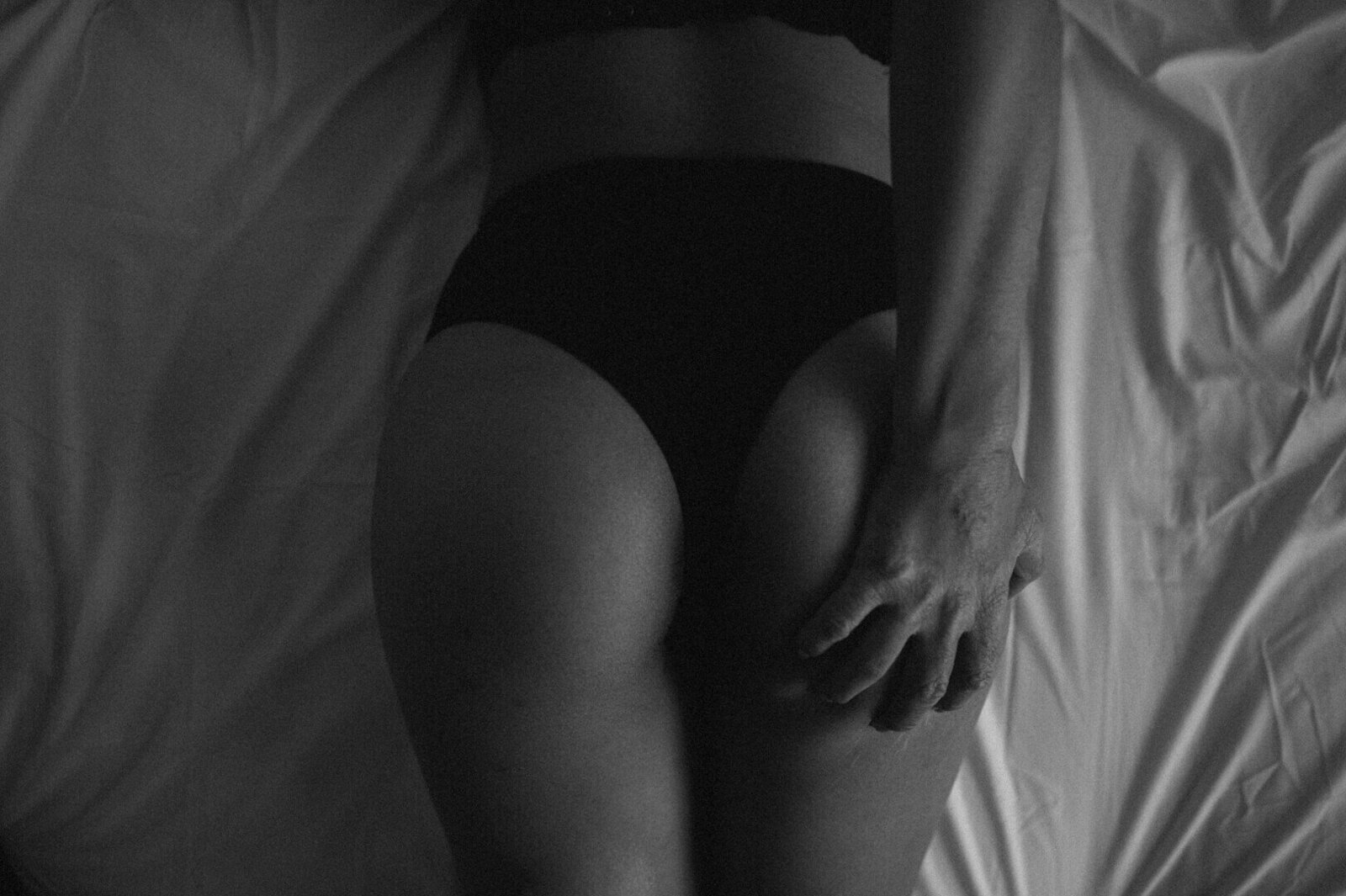 womans bottom in black underwear
