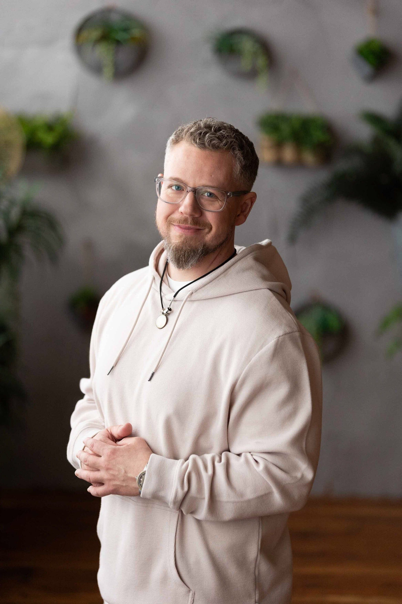 man in a white sweater standing