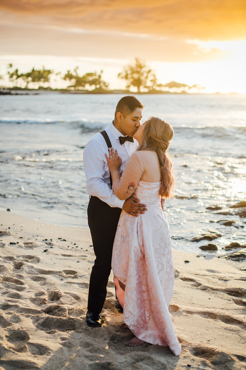 bride and groom kiss during their big island elopement