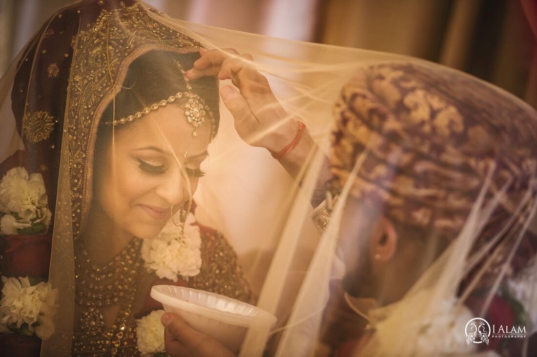 Close-up of a bride's elegant makeup in Ottawa, perfected by Neelam Kaur, a renowned Ottawa makeup artist at Red Carpet Glamour. (indian wedding)