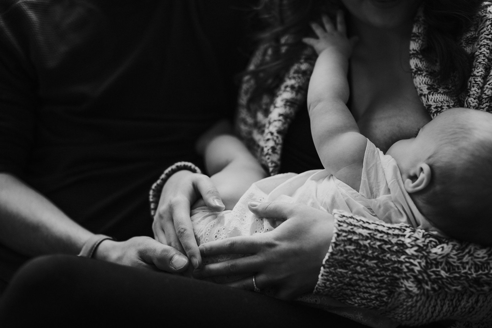 Family having an intimate moment breast feeding