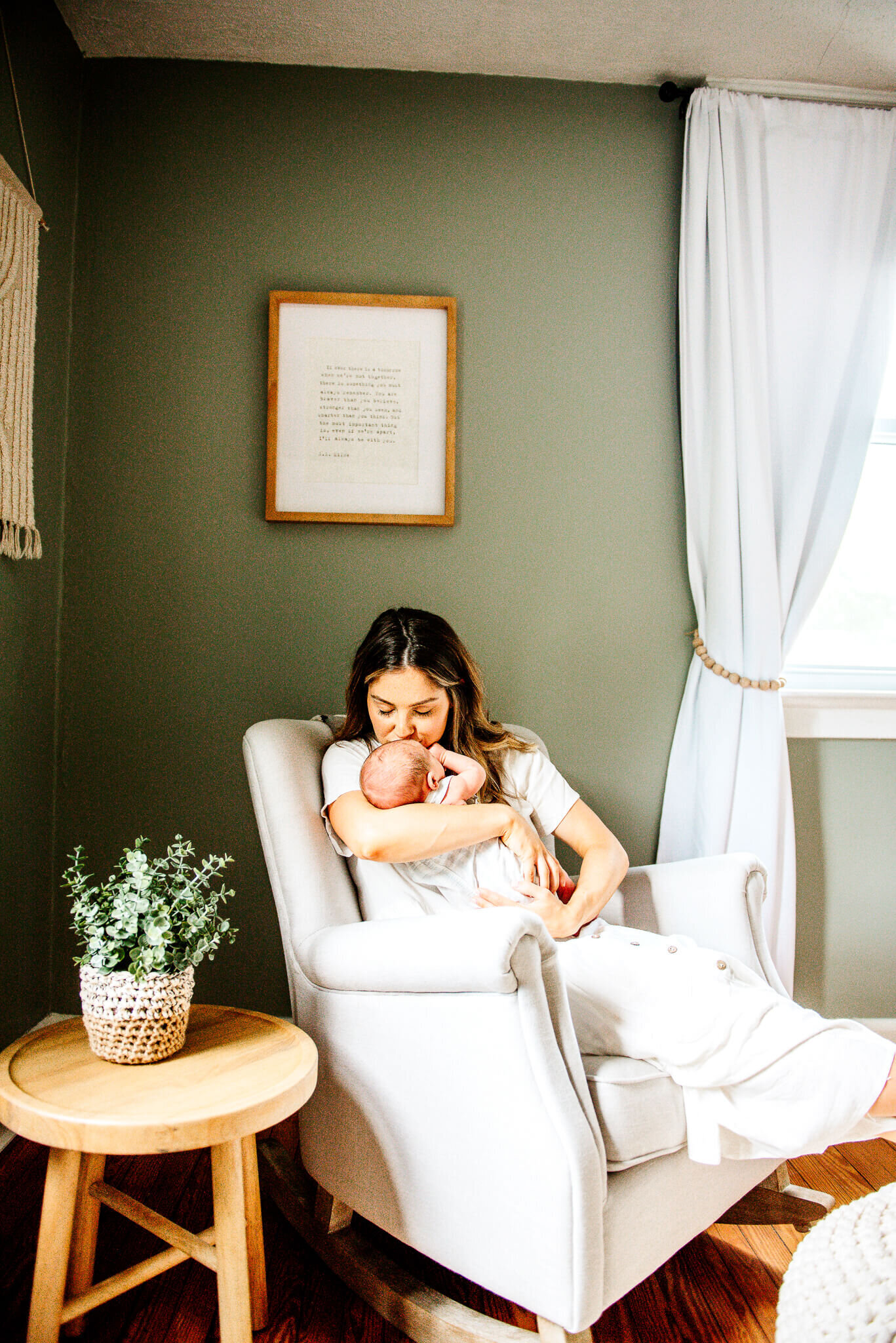 mother in rocking chair with newborn