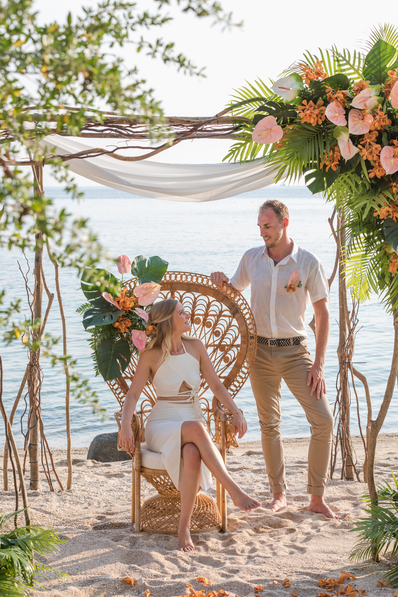 Tropical Wedding Arch and peacock chair