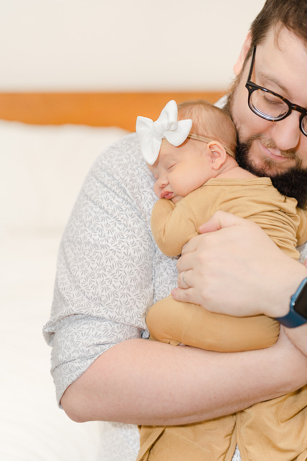 dad hugging baby during Sterling, VA newborn photo