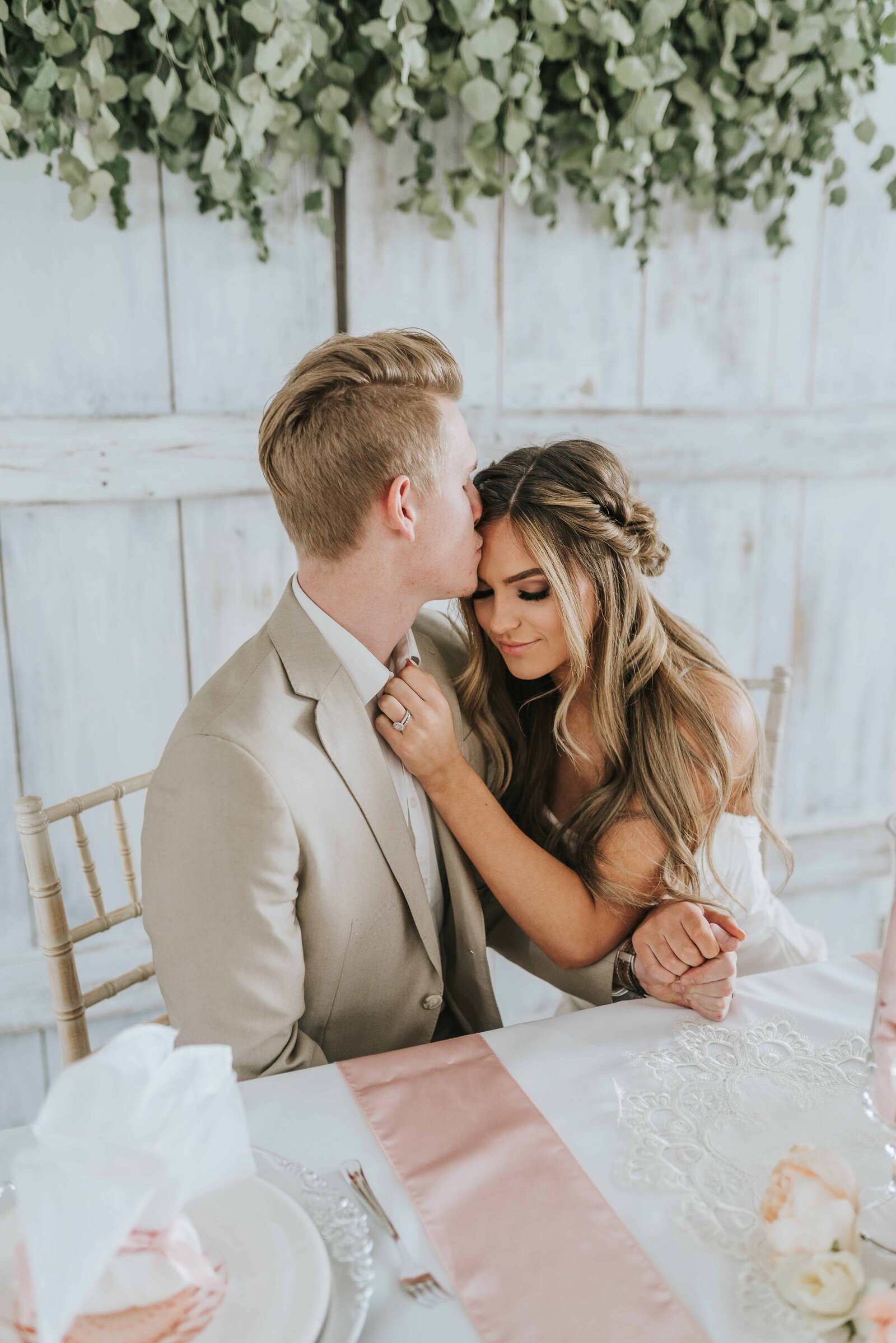 Sacramento Wedding Photographer captures groom kissing bride during bridal portraits