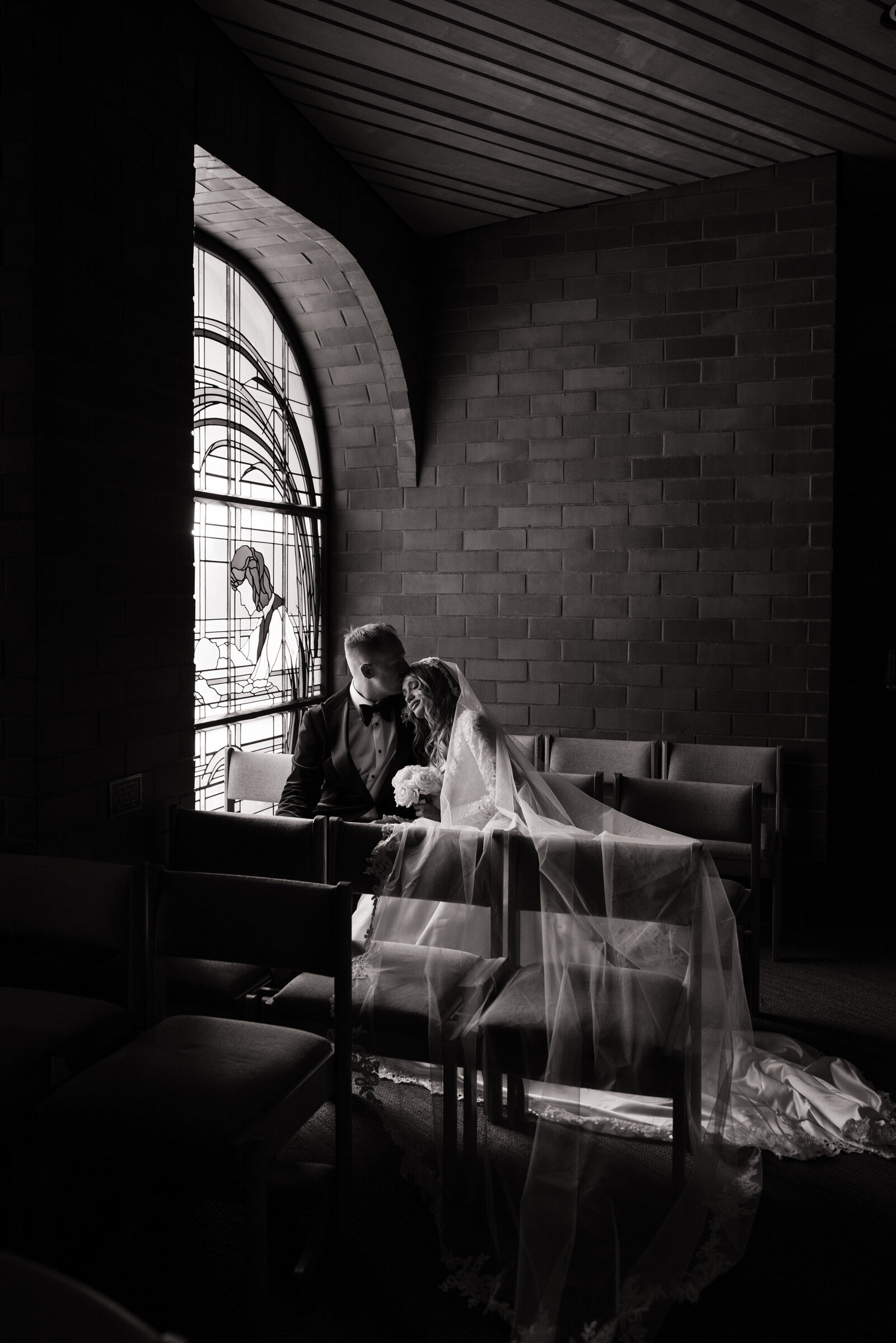 Bride and groom portraits in Idaho Catholic church
