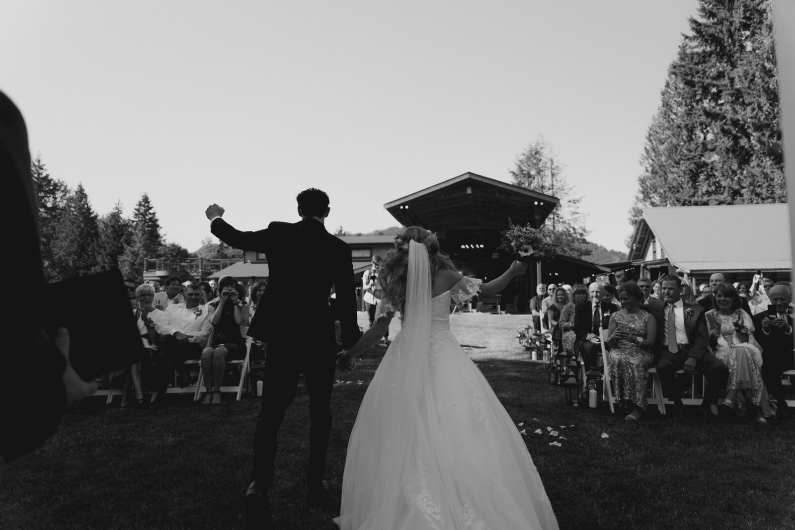 Bride and groom walking down the aisle for the first time as a married couple