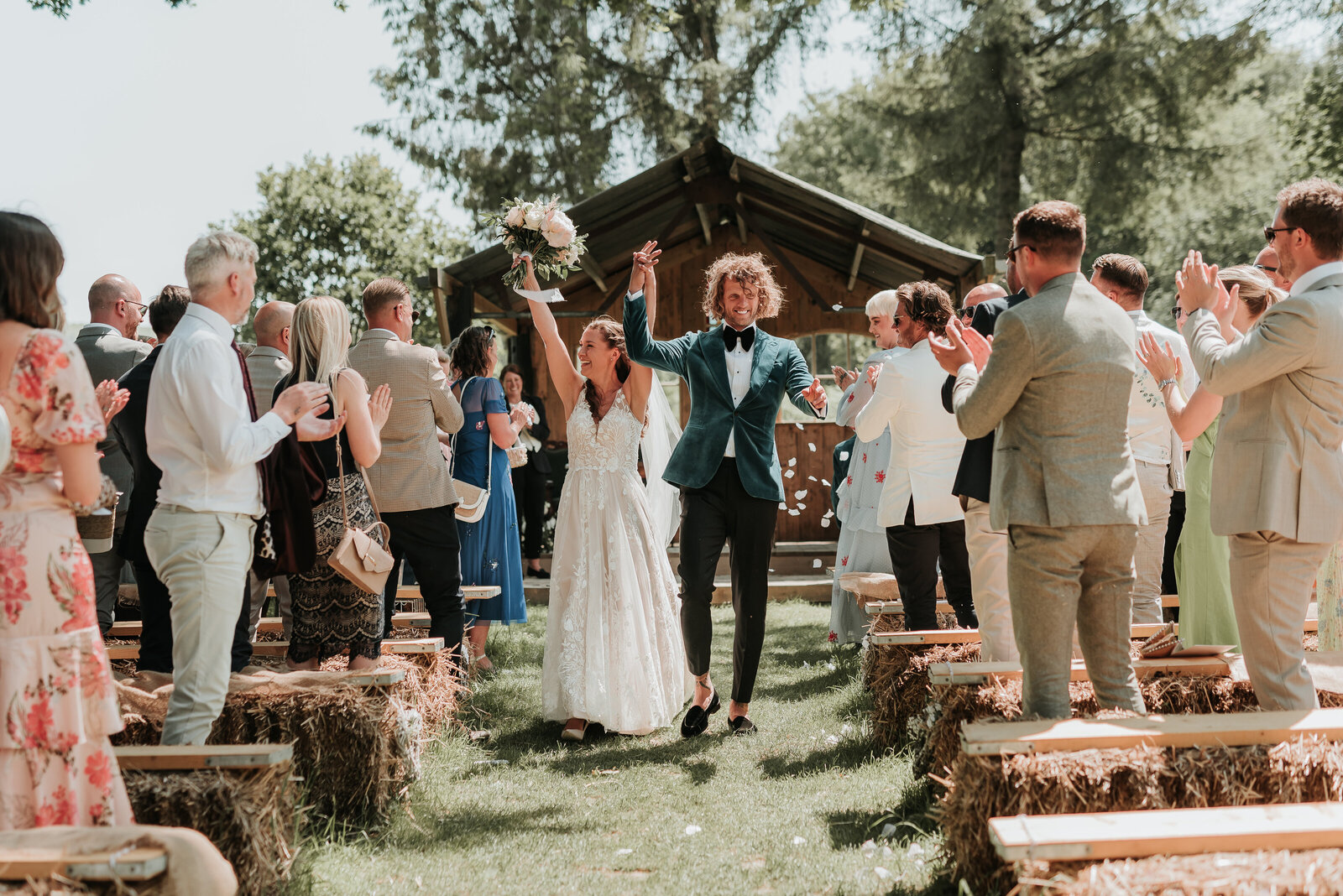 Bride and Groom celebrating walking down the aisle of confetti at Oak Tree Barn, Tonbridge