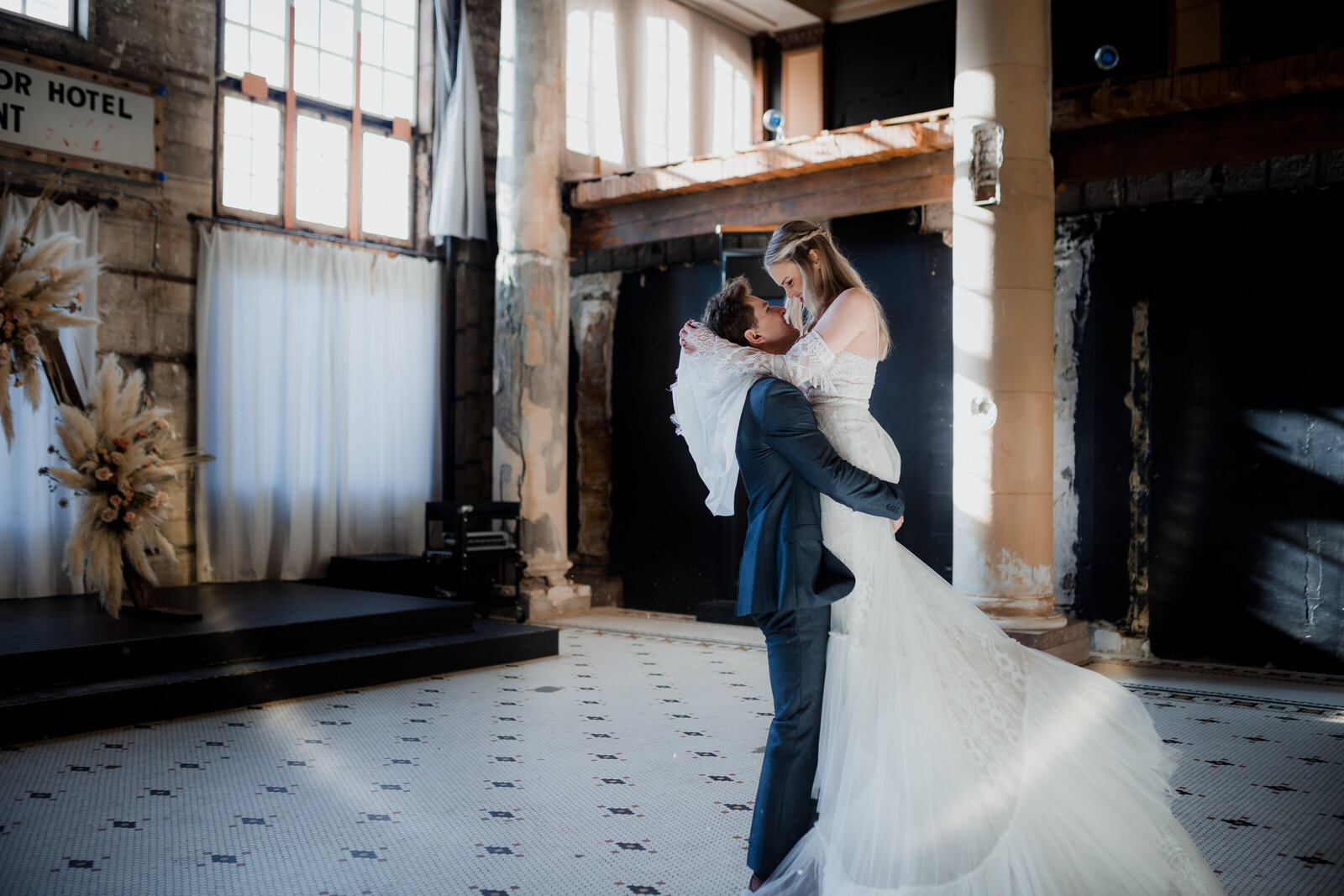Couple dancing in an airy, vintage-inspired indoor space, ideal for styled shoots for adventurous photographers in the Pacific Northwest.