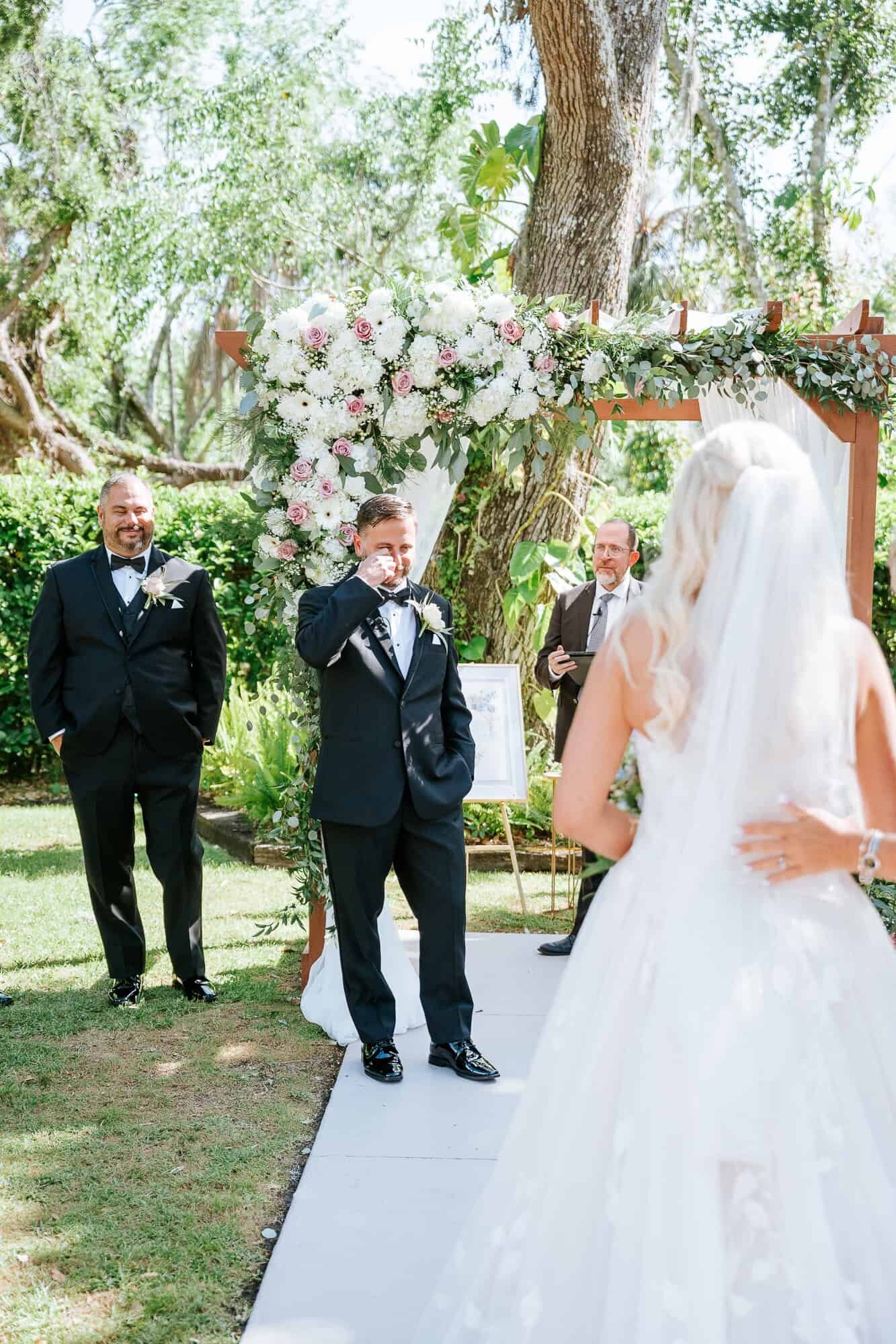 Grooms reaction to seeing bride walking down the aisle at Bakers Ranch Wedding venue