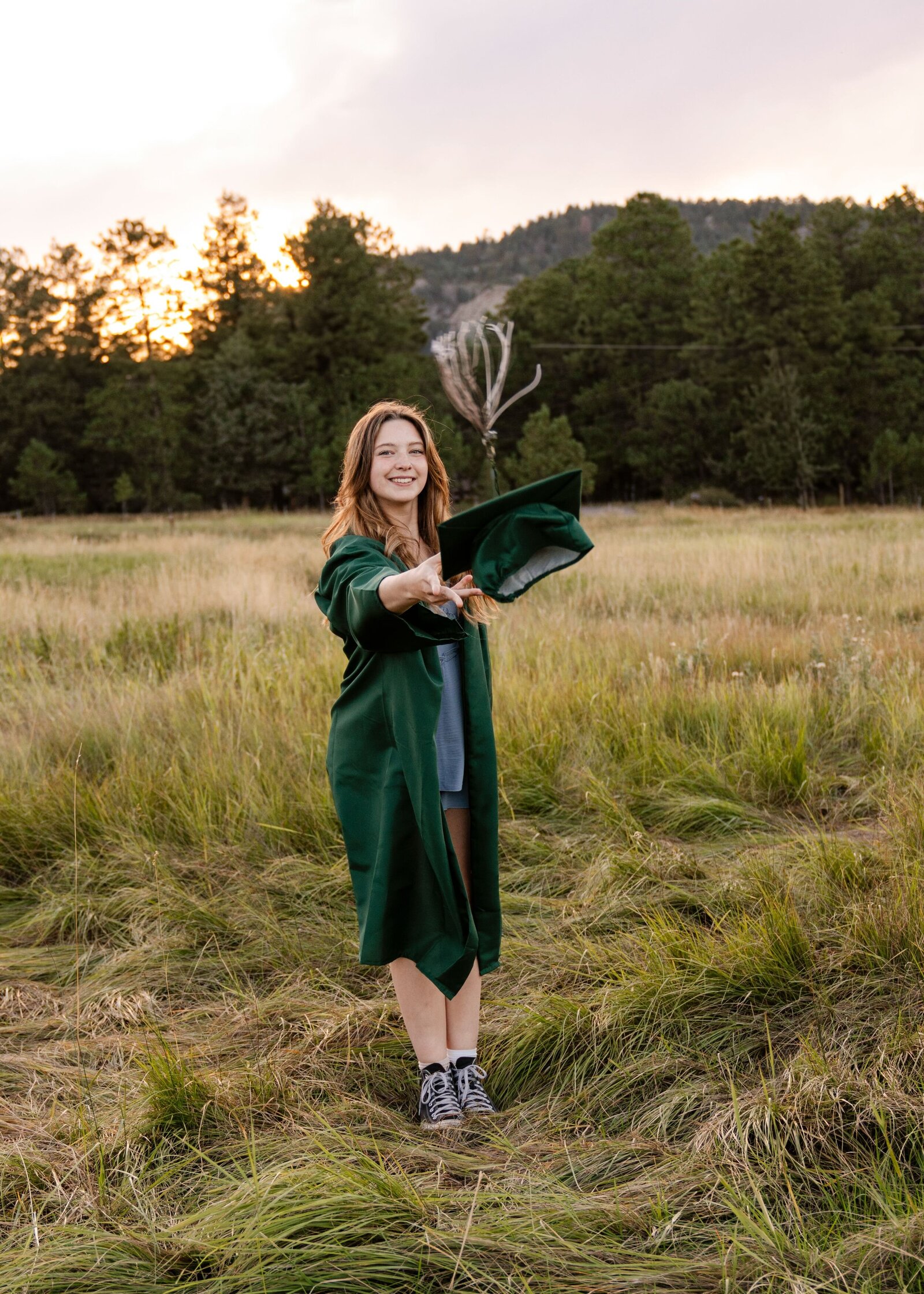 senior throwing cap in the air