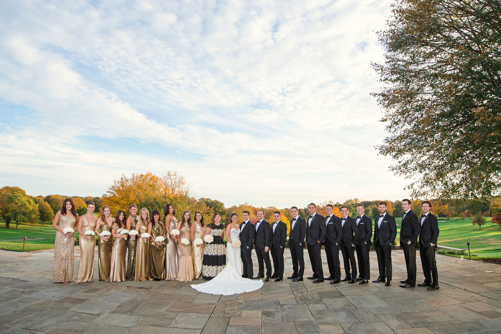 bridal party posing outside Glen Head Country Club