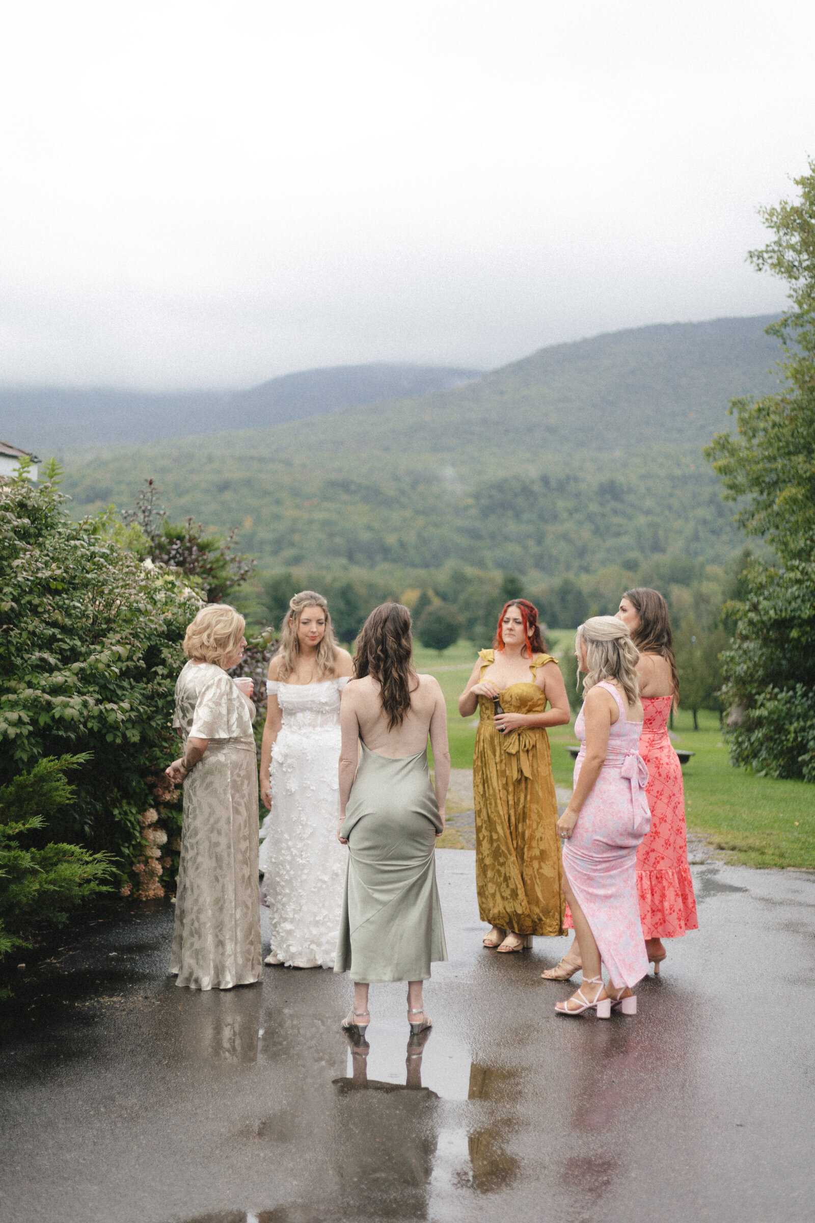 bridesmaids and bride standing together before ceremony at vermont gold course