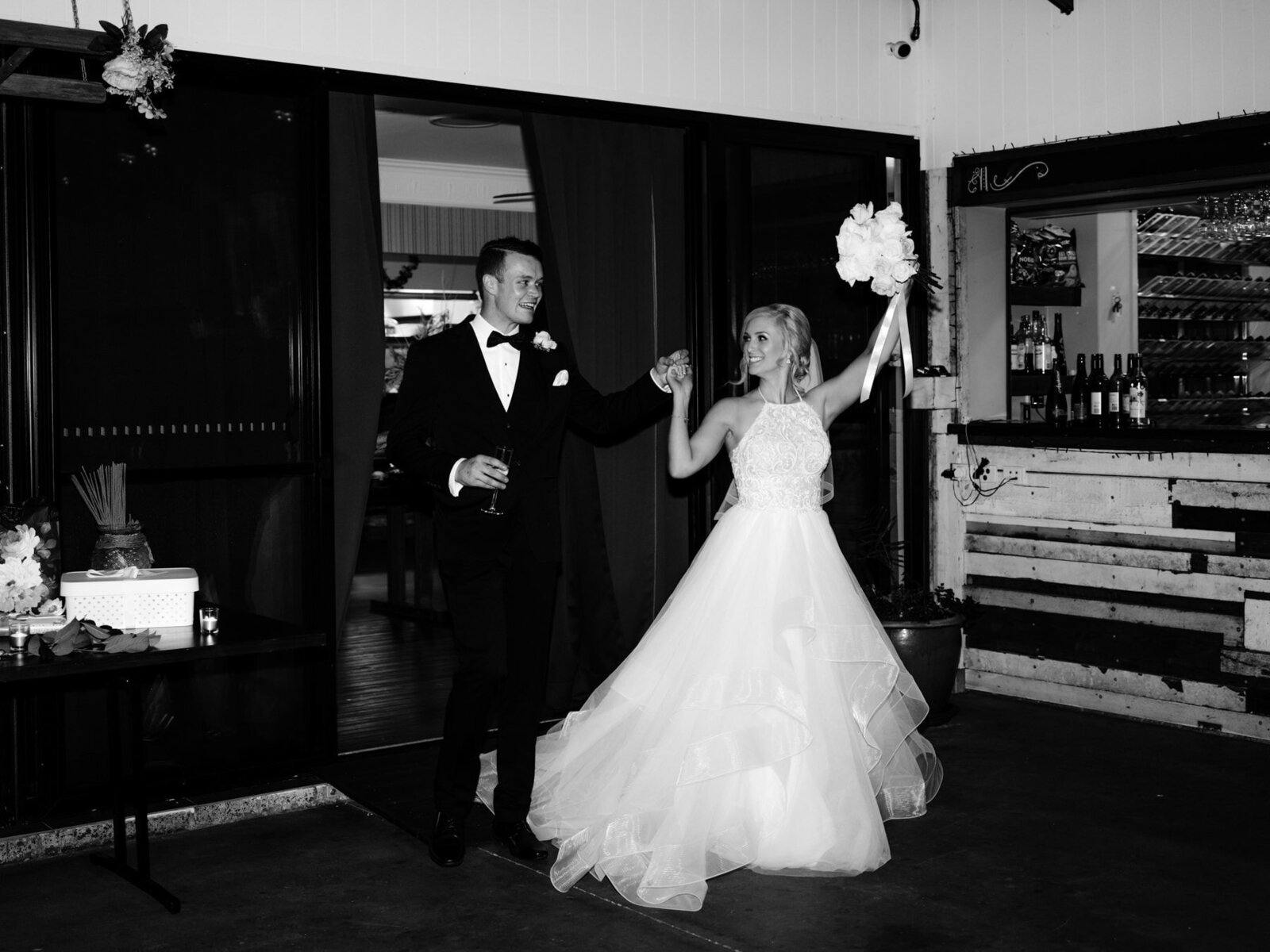 Bride and groom enter wedding reception at Austinvilla Estate