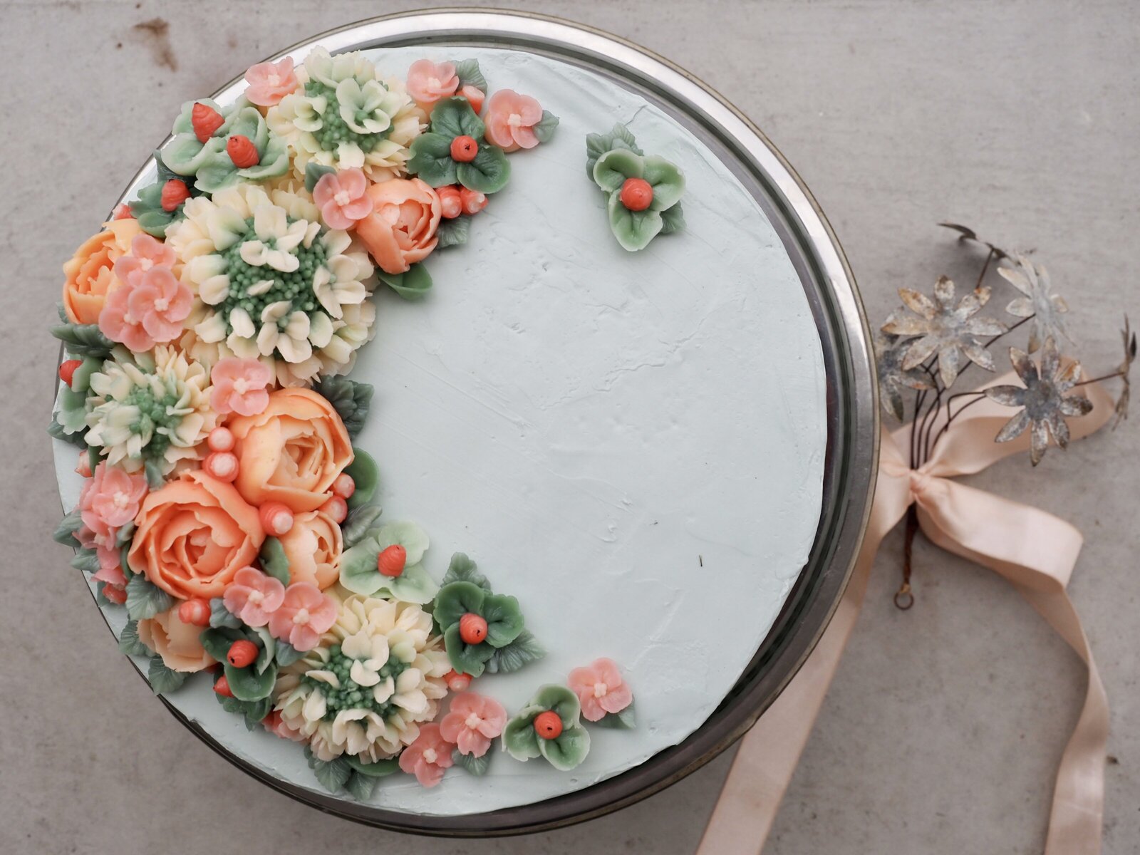 top view of hand piped flowers on a cake