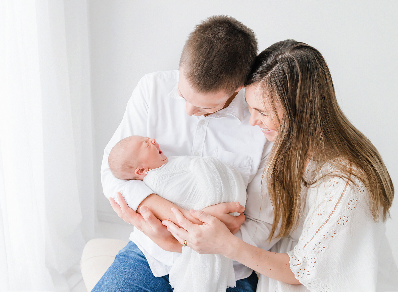 a newborn family in photo studio