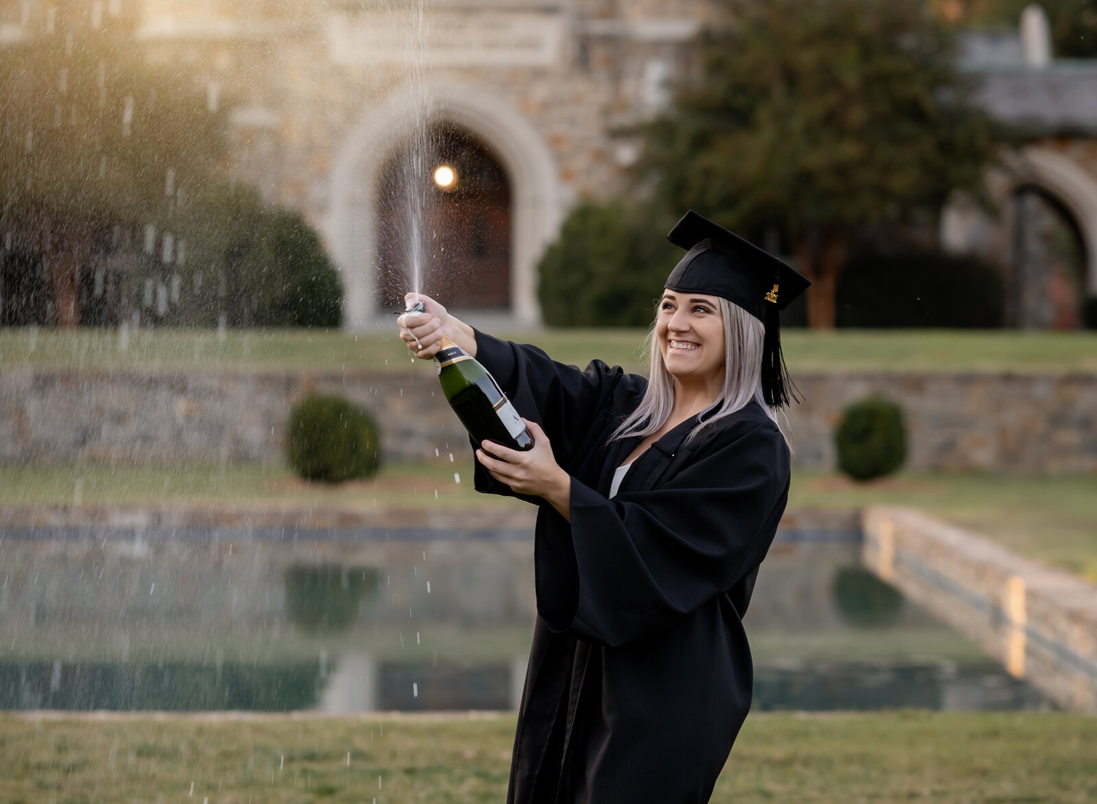 graduation picture with champagne bottle