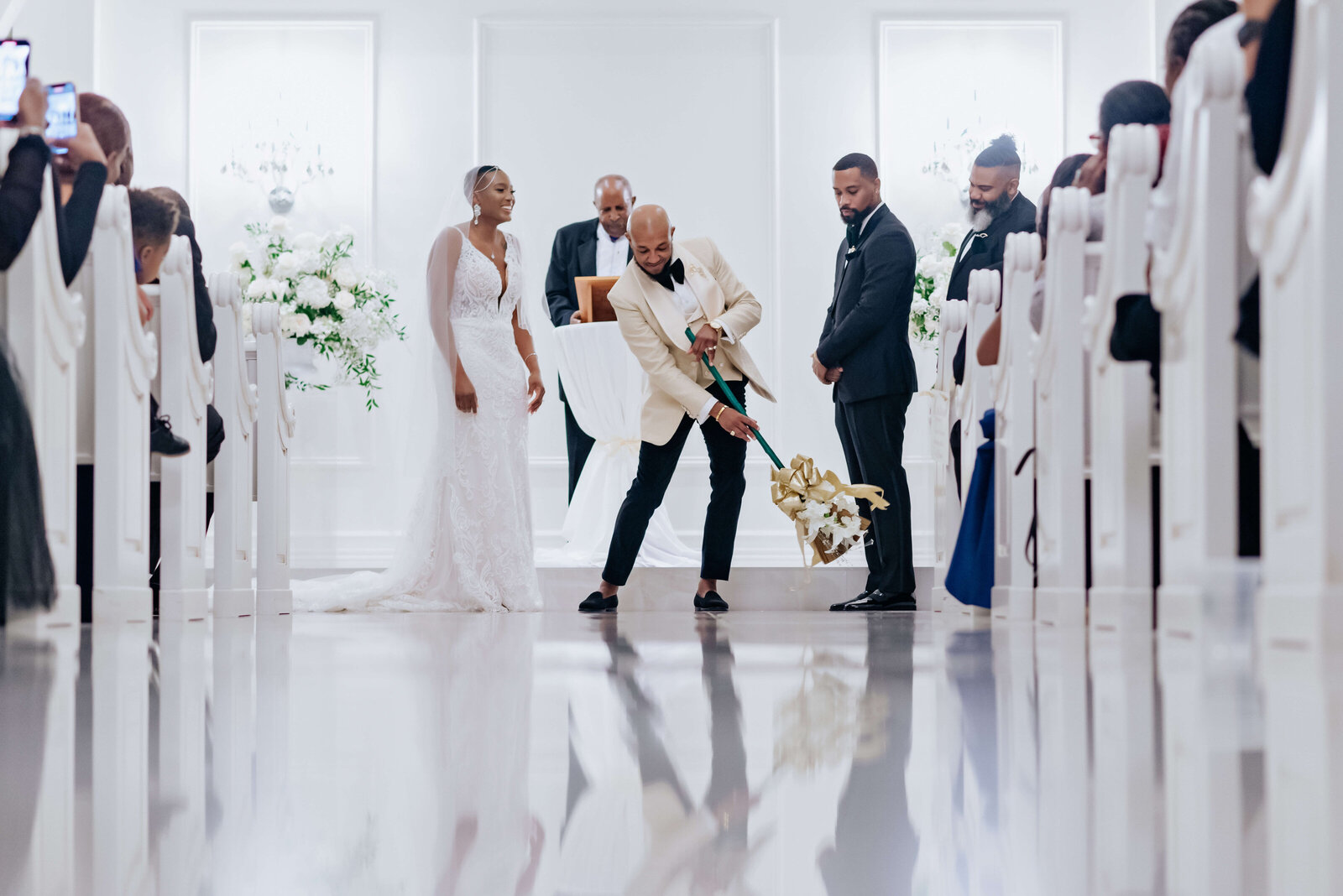 Couple jumping the broom
