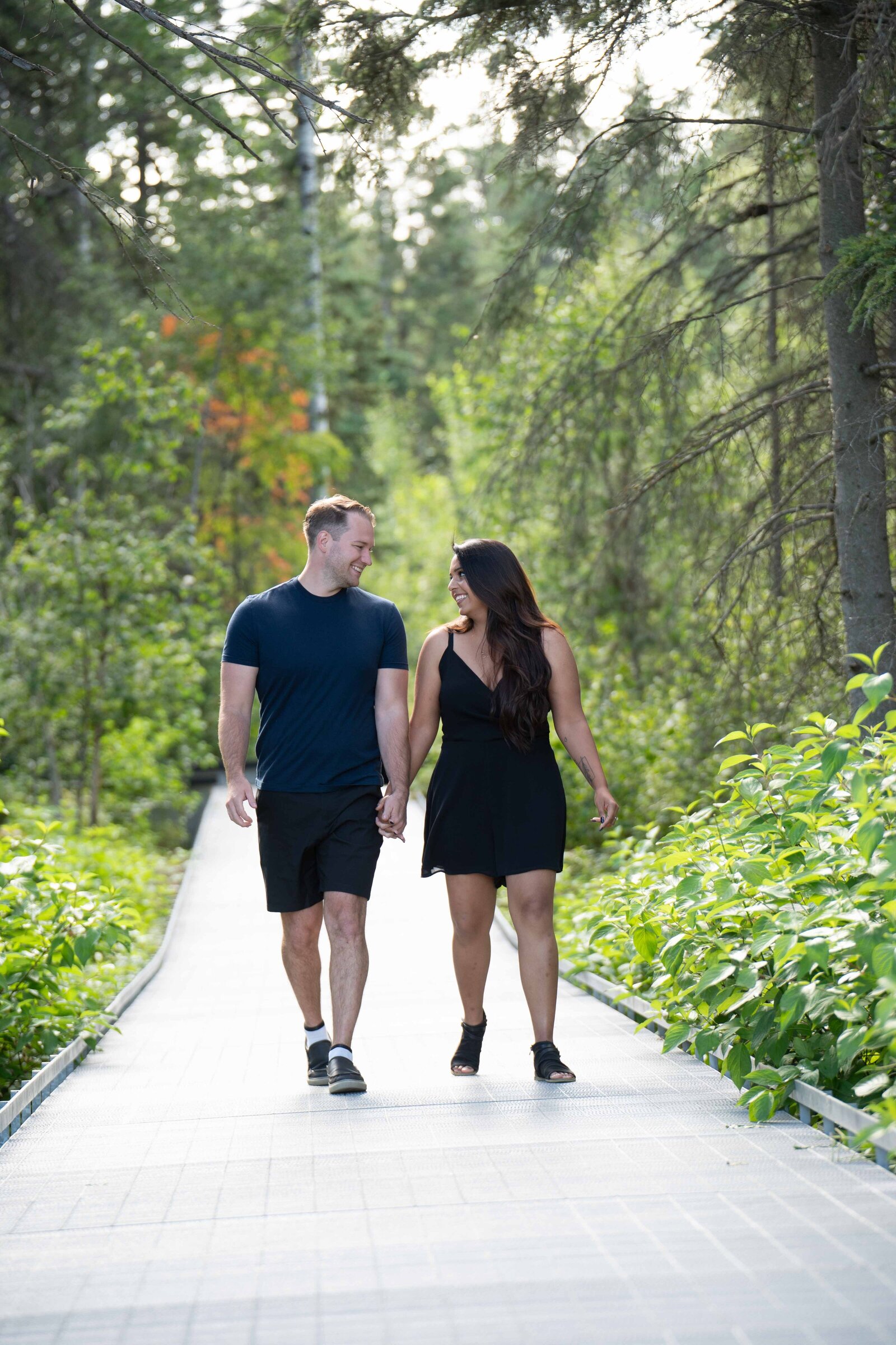 Agakhan Gardens Engagement Session walking holding hands and laughing