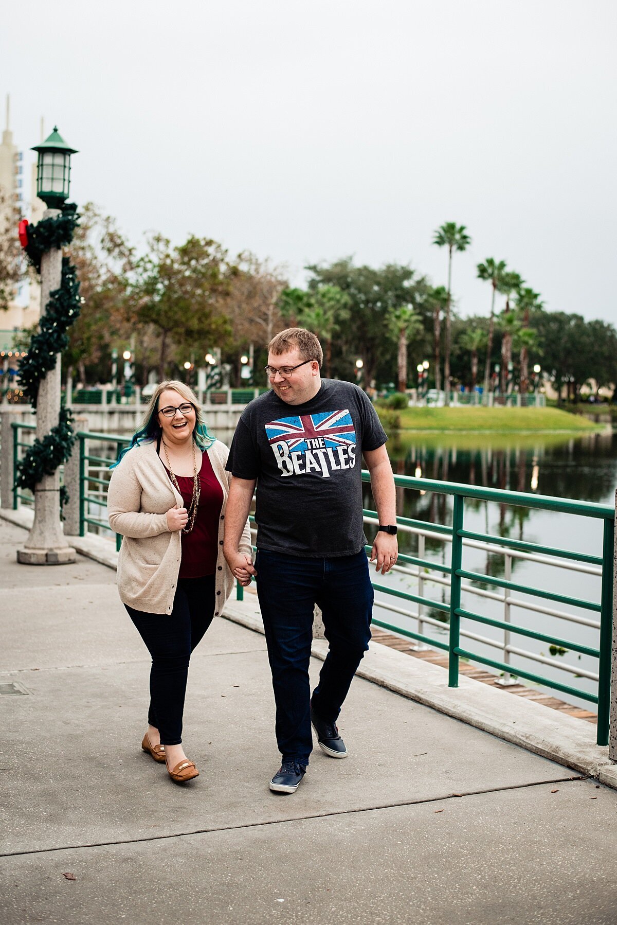 Pat and Mahlia walking together near a lake in Orlando
