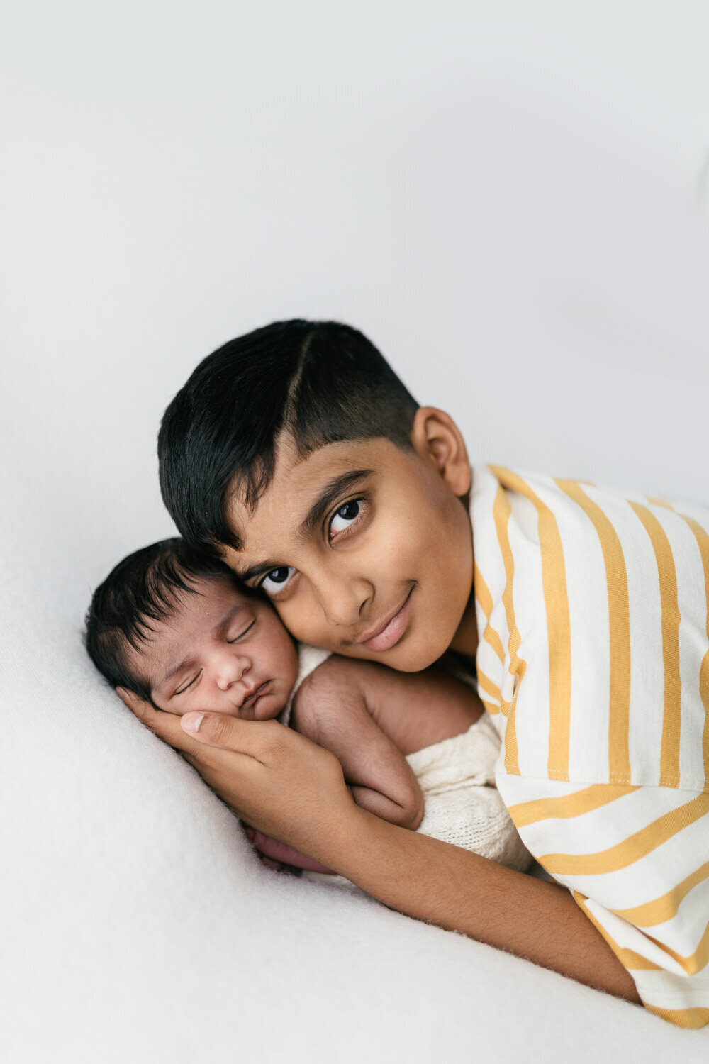 Newborn baby and sibling photograph