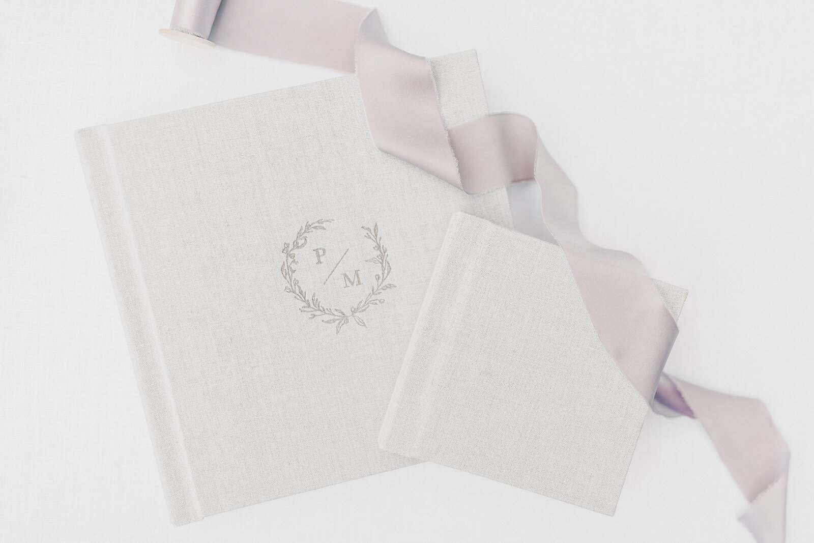 Grey baby album with pink ribbon