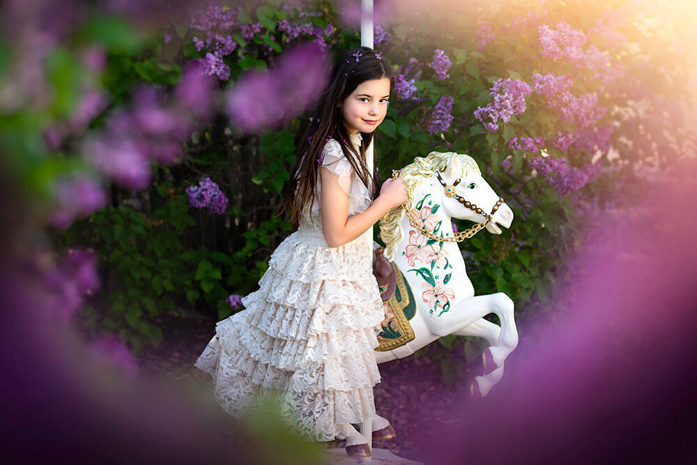 fine-art-children-carousel-horse-lilacs-whimisical-dreamy-timeless-boutique-dress-farm-studio-colorado