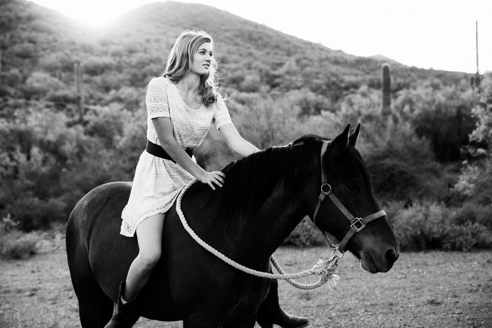 high school senior girl posing with horse