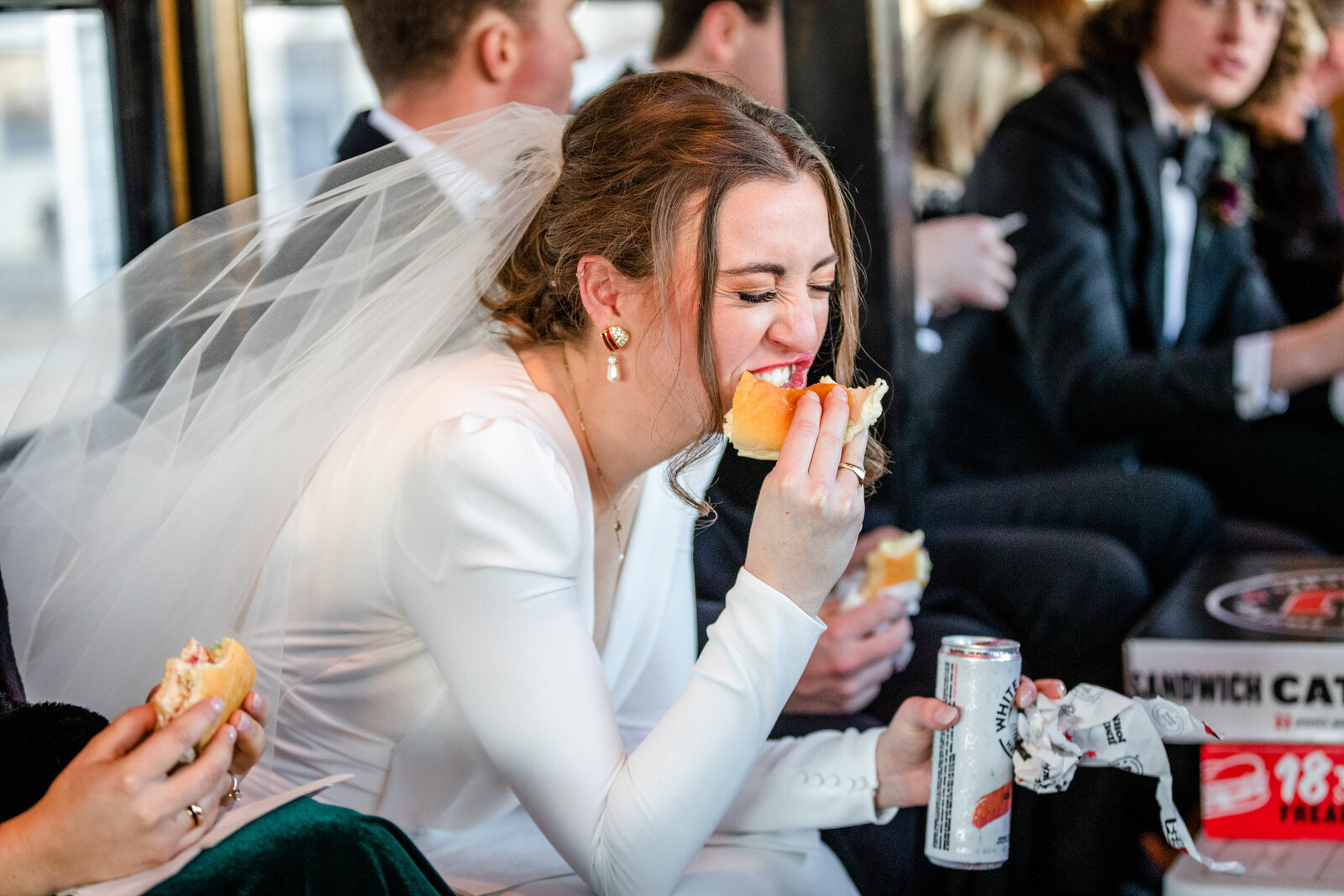 Bride eating during party bus ride