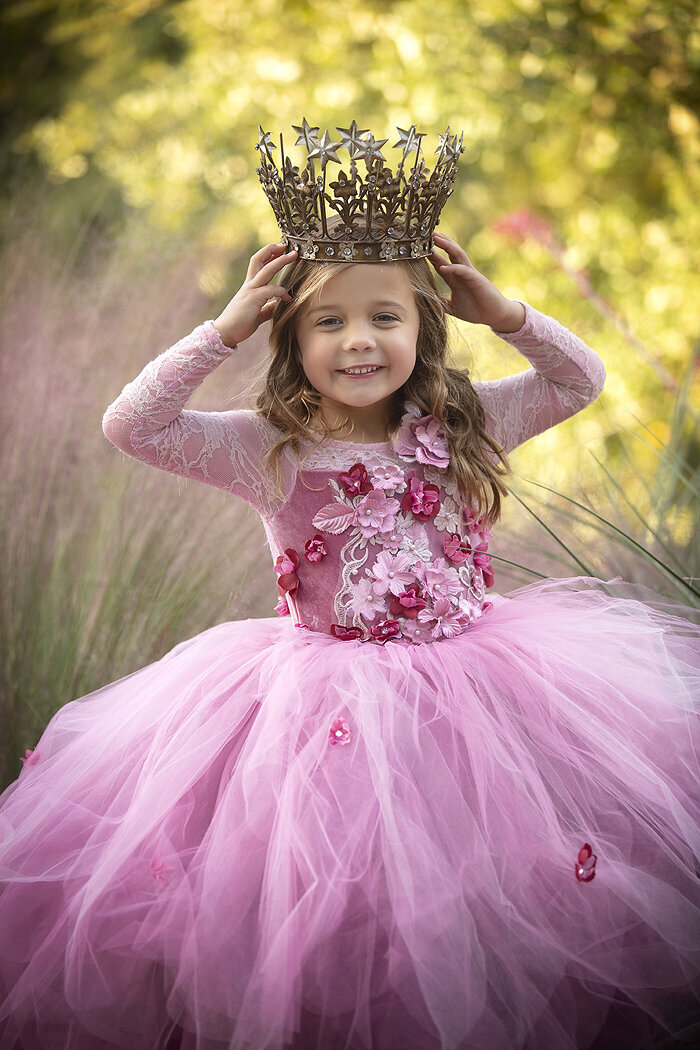 Dallas photographer photographs young girl in couture gown with a crown