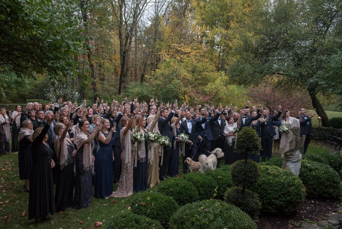 Guests gather for a toast from the balcony at Lord Thompson Manor