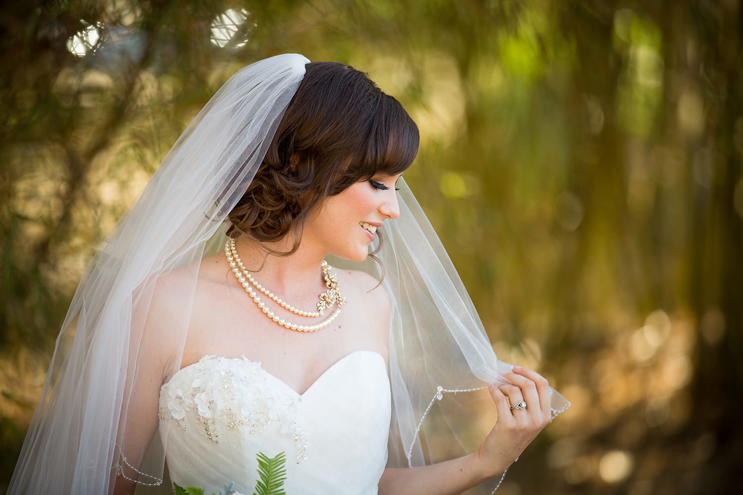 bride with veil over her face