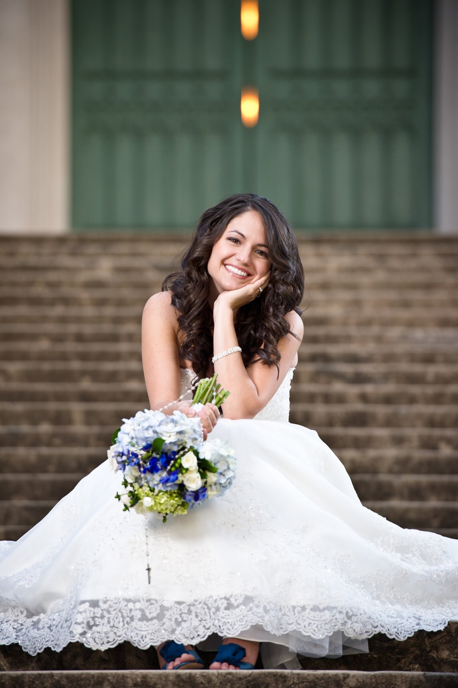 Bride sitting on steps of Old State Capitol in Baton Rouge, Louisiana