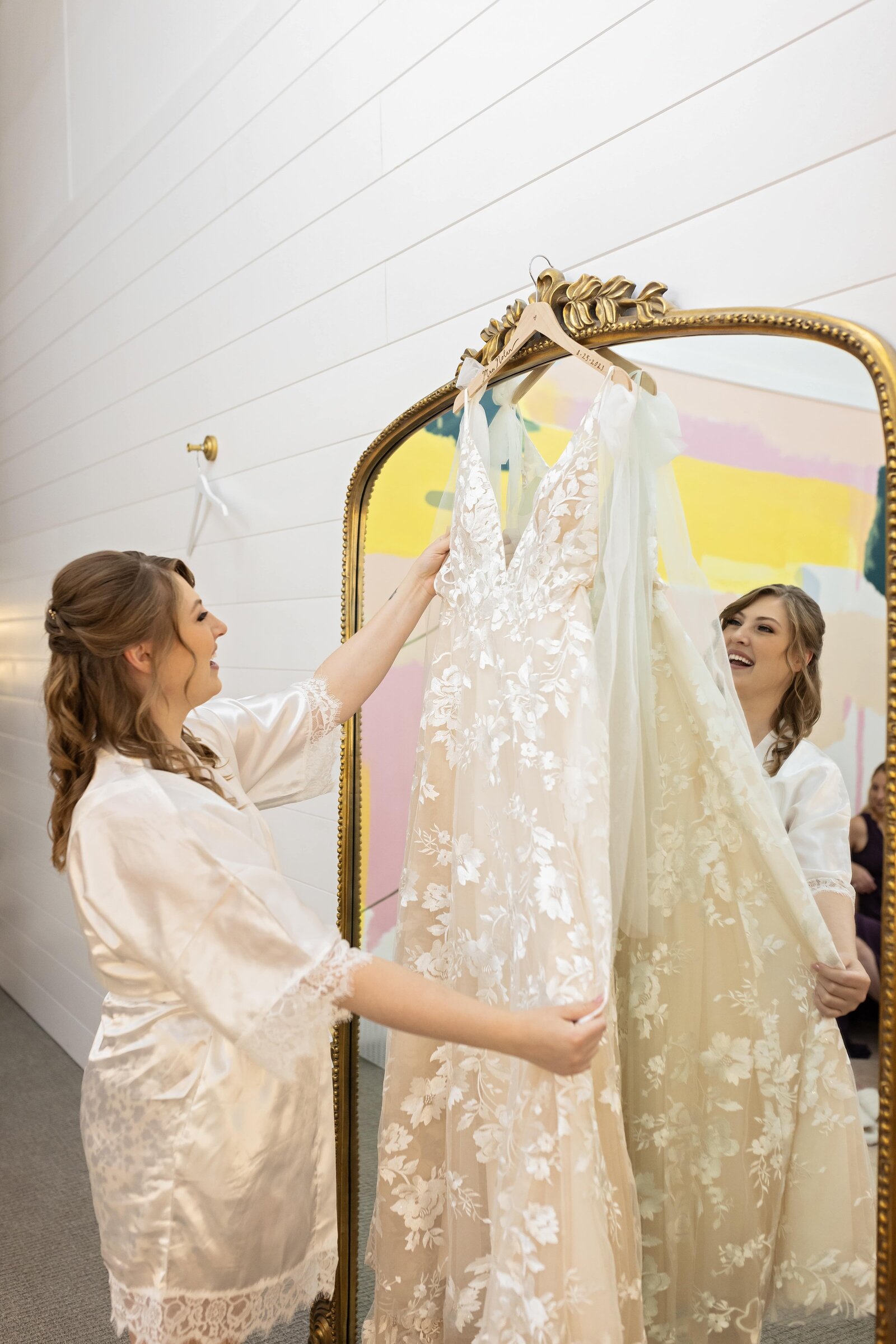 bride-wedding-wedding-dress-hanging-on-mirror