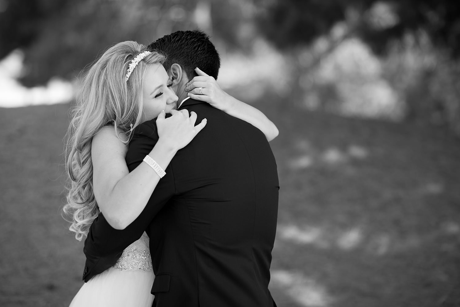 bride hugging groom after first look