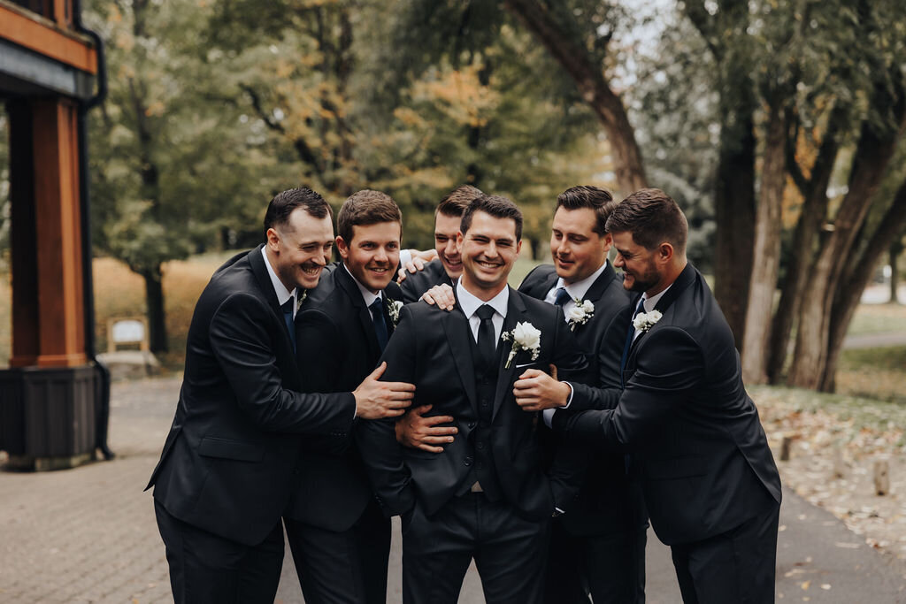 Groom and Groomsmen in Black Tuxedos