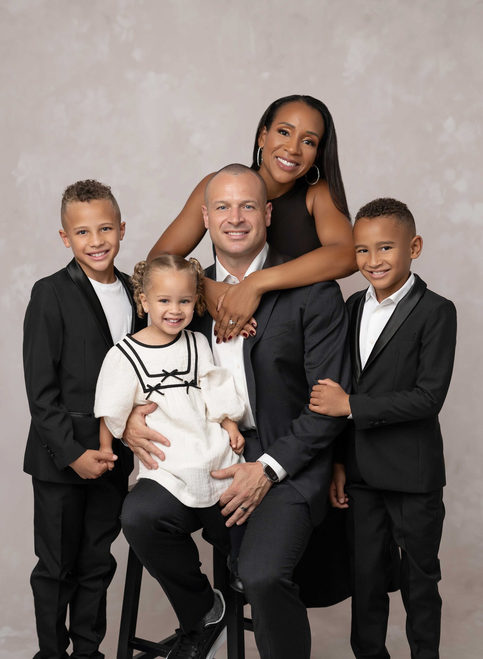 Family of 5 posing for family studio portraits. Family photo taken by Jenni Nikki Photography at Atlanta photography studio.
