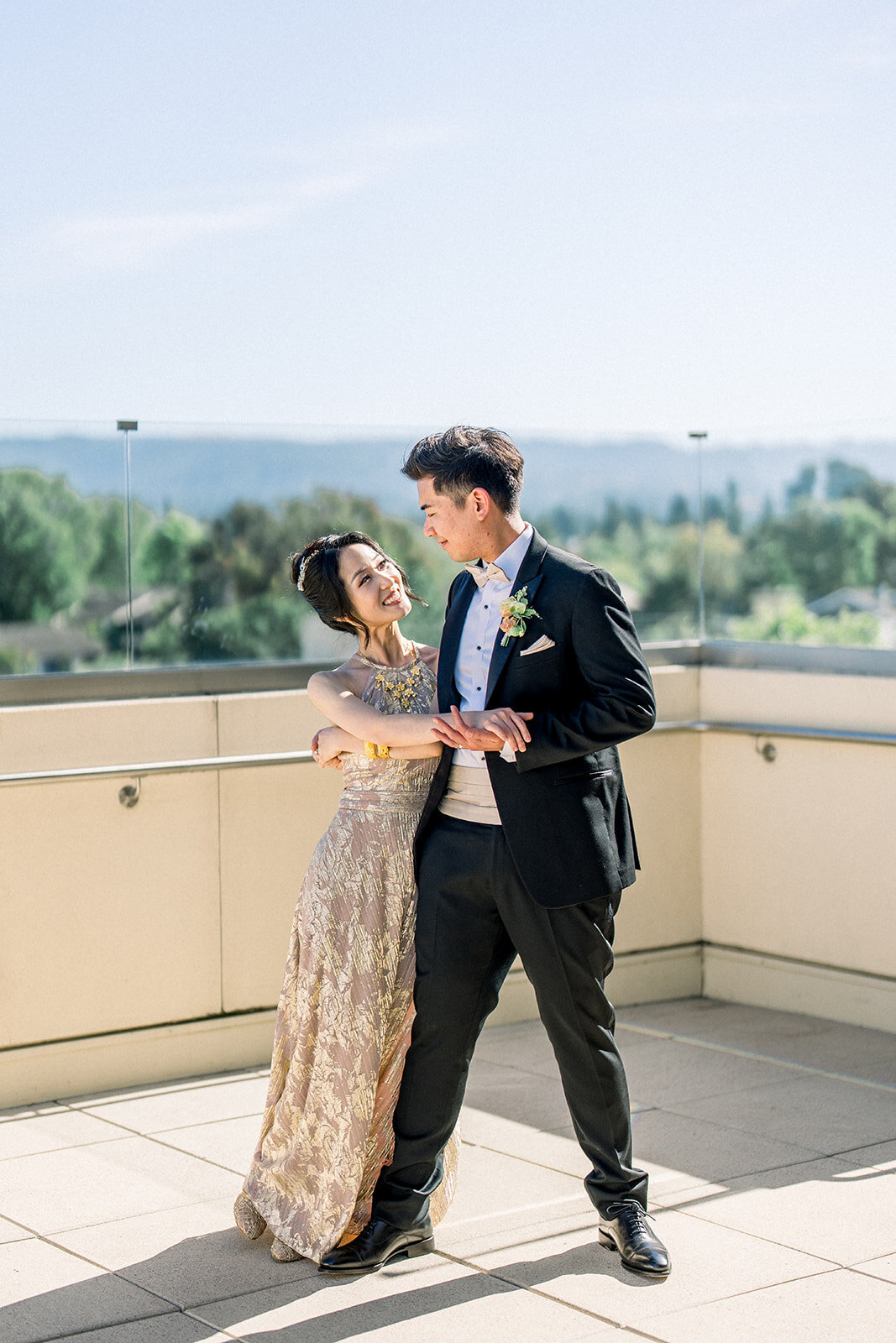 The bride and groom share a joyful first dance during their luxurious wedding reception at Filoli in Woodside, California.