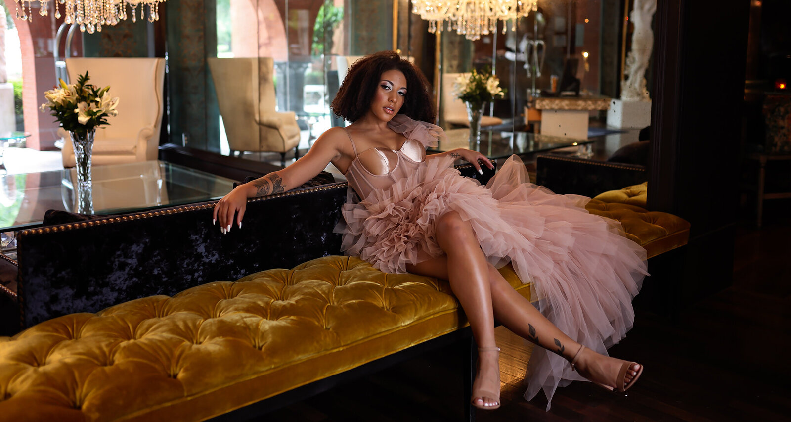 Savannah Boudoir Photography and Glamour showcases gorgeous black woman in pink designer glamour gown in Savannah fancy hotel