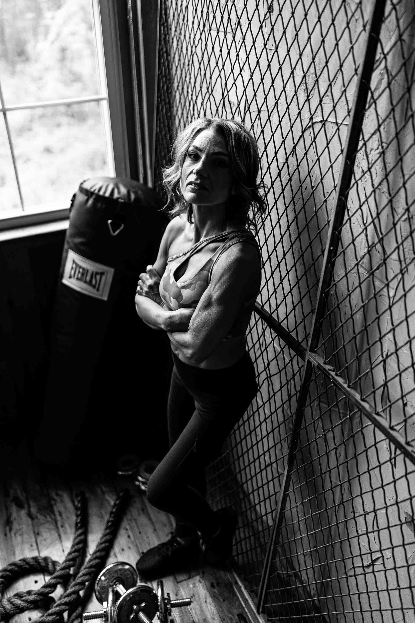 photo of a woman with a punching bag
