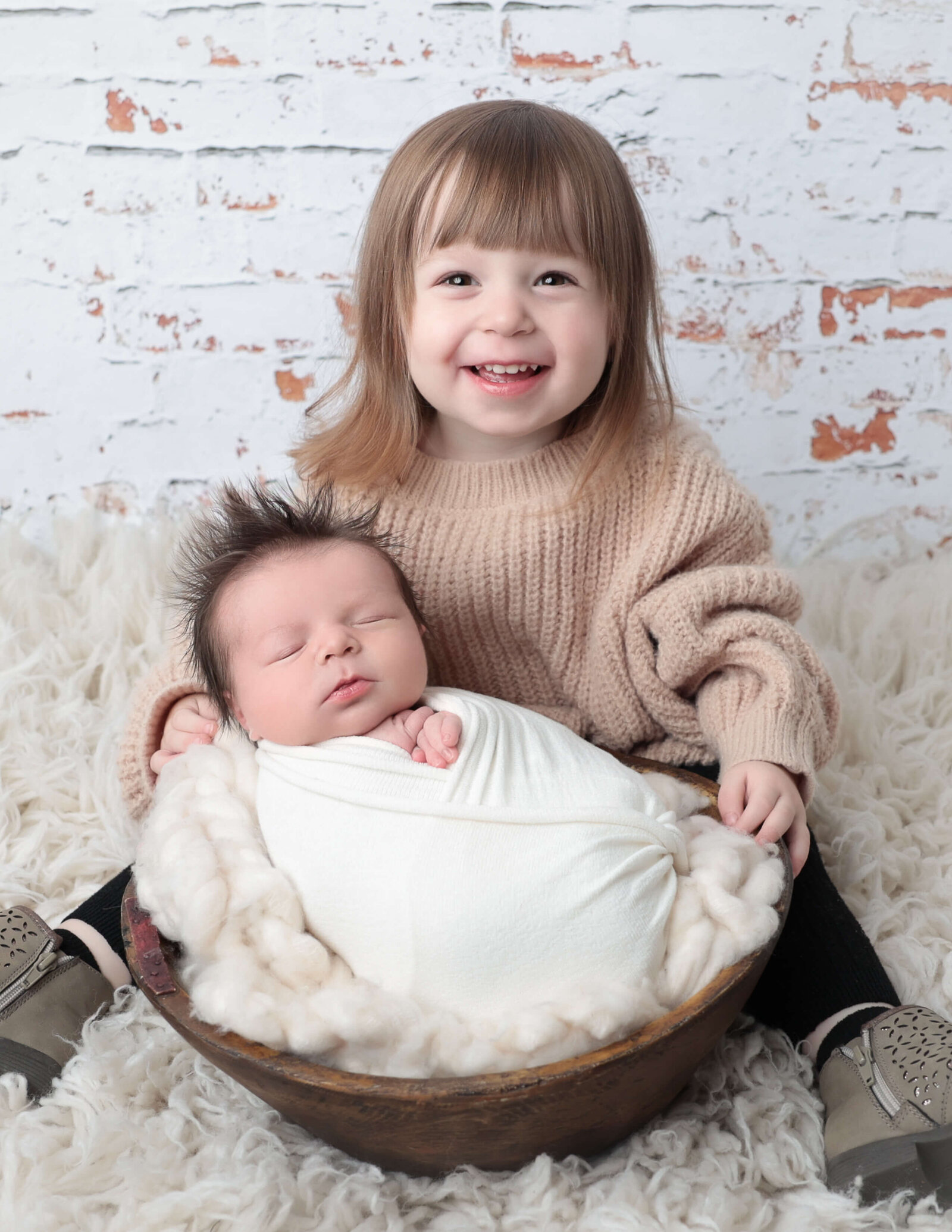 Sweet newborn boy posed with big sister, Rochester, Ny  studio.