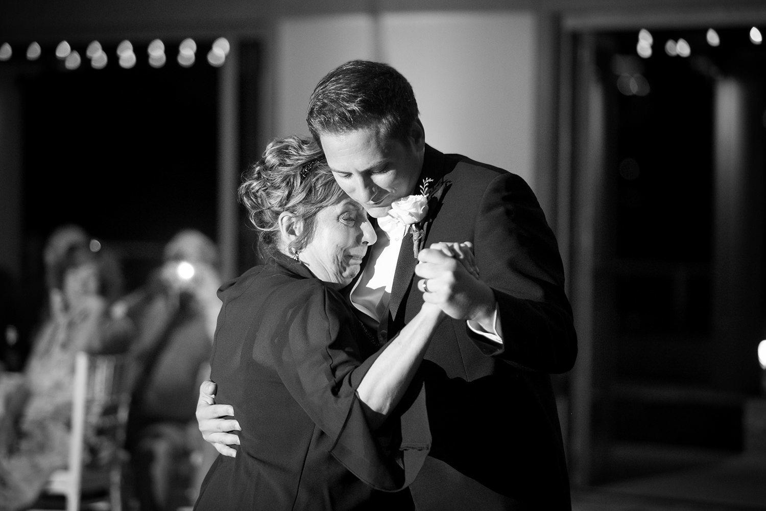 groom dancing with mom at coronado community center